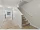 Open hallway with carpeted stairs and neutral walls leading to additional rooms at 755 Magnolia Gardens Walk, Mcdonough, GA 30253