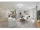Bright living room with modern decor, carpet, and breakfast bar pass through to kitchen at 755 Magnolia Gardens Walk, Mcdonough, GA 30253