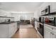 Modern kitchen featuring stainless steel appliances and sleek white cabinetry at 93 Terry St # A, Atlanta, GA 30312