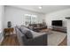 Cozy living room with gray sofas, wood floors, and natural light at 93 Terry St # A, Atlanta, GA 30312