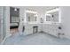 Bright bathroom featuring double vanity, large mirrors, and a walk-in shower at 1775 Potomac Ct, Lawrenceville, GA 30043