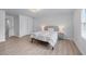 Clean bedroom features neutral paint, hardwood floors, and large windows at 1775 Potomac Ct, Lawrenceville, GA 30043