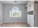 Spacious walk-in closet with custom shelving, drawers, and a large window at 1775 Potomac Ct, Lawrenceville, GA 30043