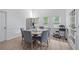 Bright dining area featuring lots of light, neutral color scheme, round table and seating for six at 1775 Potomac Ct, Lawrenceville, GA 30043