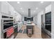 Modern kitchen with stainless steel appliances, ample counter space, and a view into living room at 1775 Potomac Ct, Lawrenceville, GA 30043
