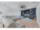Cozy living room with a fireplace, custom built-ins, and comfortable seating at 1775 Potomac Ct, Lawrenceville, GA 30043