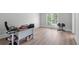 Bright home office space with a large window and neutral walls and floors at 1775 Potomac Ct, Lawrenceville, GA 30043