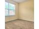 Cozy bedroom with neutral walls and a large window, perfect for relaxation at 3703 Liberty Sw Dr, Powder Springs, GA 30127