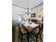 Beautiful dining room with hardwood floors, chandelier and seating for six at 3703 Liberty Sw Dr, Powder Springs, GA 30127