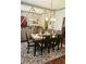 Elegant dining room featuring a modern chandelier and seating for six at 3703 Liberty Sw Dr, Powder Springs, GA 30127