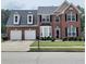 Charming brick home with well-maintained landscaping, two-car garage, and a welcoming entrance at 3703 Liberty Sw Dr, Powder Springs, GA 30127
