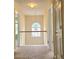 Hallway with carpet, natural light, and wooden hand railing at 3703 Liberty Sw Dr, Powder Springs, GA 30127