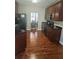 Spacious kitchen with modern appliances and an open view to the dining area at 3703 Liberty Sw Dr, Powder Springs, GA 30127