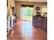 Spacious kitchen with sliding glass doors, hardwood floors, dark cabinets and outside views bringing natural light at 3703 Liberty Sw Dr, Powder Springs, GA 30127
