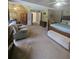 Spacious main bedroom with natural light, ceiling fan, and sitting area at 3703 Liberty Sw Dr, Powder Springs, GA 30127