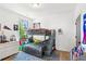 bedroom with a bunk bed, light wood floors, and a large window at 6925 Colfax Ave, Cumming, GA 30040