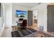 A home office with neutral tones, natural light, and space for a desk and seating at 6925 Colfax Ave, Cumming, GA 30040