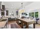 Gourmet kitchen with stainless steel appliances, center island, and stylish tile backsplash at 6925 Colfax Ave, Cumming, GA 30040