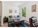 Cozy living room with soft seating, natural light, and hardwood floors at 6925 Colfax Ave, Cumming, GA 30040