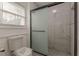 Bathroom showcasing tiled walk-in shower and window at 7020 Camp Valley Rd, Riverdale, GA 30296