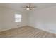 Bright bedroom with wood-look flooring, a ceiling fan, and natural light from window at 7020 Camp Valley Rd, Riverdale, GA 30296