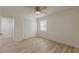 Bright bedroom features wood-look flooring, natural light, and a double door closet at 7020 Camp Valley Rd, Riverdale, GA 30296