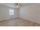 Bedroom with ceiling fan, hardwood-style flooring, and a well-lit interior at 7020 Camp Valley Rd, Riverdale, GA 30296