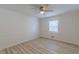 Bedroom features light-colored wood-look floors, ceiling fan and a window at 7020 Camp Valley Rd, Riverdale, GA 30296