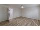 Bright bedroom showcasing wood-look floors and an opened door at 7020 Camp Valley Rd, Riverdale, GA 30296