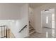 Entryway view with tiled flooring, stairway and white front door with glass panel at 7020 Camp Valley Rd, Riverdale, GA 30296