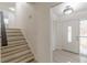 Entryway view with tiled flooring and stairway leading to upper floors at 7020 Camp Valley Rd, Riverdale, GA 30296
