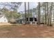 Quaint two-story home with mature trees, nice lawn and ample space at 7020 Camp Valley Rd, Riverdale, GA 30296