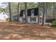 Quaint two-story home with mature trees and attached garage at 7020 Camp Valley Rd, Riverdale, GA 30296
