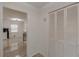 View of the hallway with ceramic tile flooring and closet at 7020 Camp Valley Rd, Riverdale, GA 30296