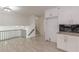 Bright, open kitchen featuring modern cabinets and stainless steel railing to other parts of the house at 7020 Camp Valley Rd, Riverdale, GA 30296