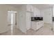 Bright kitchen view with white cabinets and updated flooring and counter tops at 7020 Camp Valley Rd, Riverdale, GA 30296