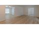 Spacious open-concept living room featuring beautiful hardwood flooring and fresh neutral paint at 7020 Camp Valley Rd, Riverdale, GA 30296
