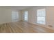 Clean and bright living room featuring hardwood floors and fresh neutral paint at 7020 Camp Valley Rd, Riverdale, GA 30296