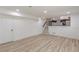 Bright living room featuring wood floors, neutral walls, and access to the upper level at 7020 Camp Valley Rd, Riverdale, GA 30296