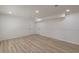 View of the living room featuring wood floors and neutral walls and trim at 7020 Camp Valley Rd, Riverdale, GA 30296
