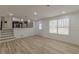 Bright living room featuring wood floors, neutral walls, and access to the upper level at 7020 Camp Valley Rd, Riverdale, GA 30296