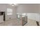 Loft area with modern railings, adjacent to kitchen area and stairway at 7020 Camp Valley Rd, Riverdale, GA 30296