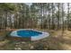 Tranquil view of the private, in-ground swimming pool at 7020 Camp Valley Rd, Riverdale, GA 30296