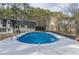 Exterior shot of the home and backyard featuring an in-ground swimming pool at 7020 Camp Valley Rd, Riverdale, GA 30296