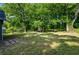 A spacious backyard with plenty of shade and a storage shed at the back of the lot at 958 Crew Sw St, Atlanta, GA 30315
