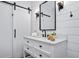 Modern bathroom featuring a sliding door, a vanity, and ship lap walls at 958 Crew Sw St, Atlanta, GA 30315