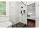 Elegant bathroom featuring a glass shower with a tiled accent wall and view of a bedroom at 958 Crew Sw St, Atlanta, GA 30315