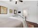 Bright bedroom features wood floors, neutral walls, and a cozy iron bed frame at 958 Crew Sw St, Atlanta, GA 30315