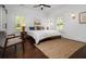 Inviting bedroom features plantation shutters, hardwood floors, and neutral decor for a relaxing atmosphere at 958 Crew Sw St, Atlanta, GA 30315