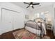 Bright bedroom features wood floors, neutral walls, and a cozy iron bed frame at 958 Crew Sw St, Atlanta, GA 30315